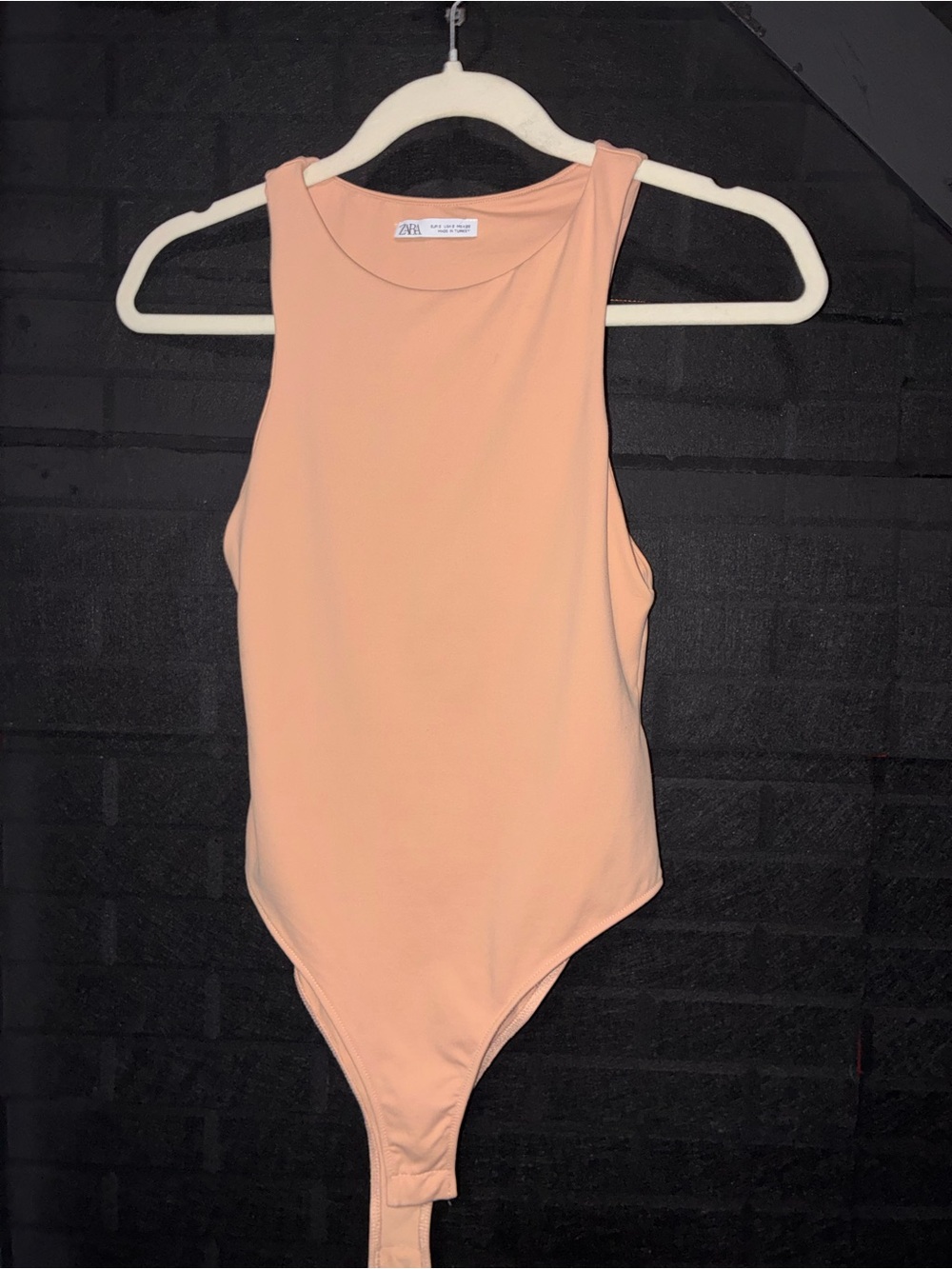 Zara women’s Peach Tank One-Piece Bodysuit. High neck, stretch snap closure.